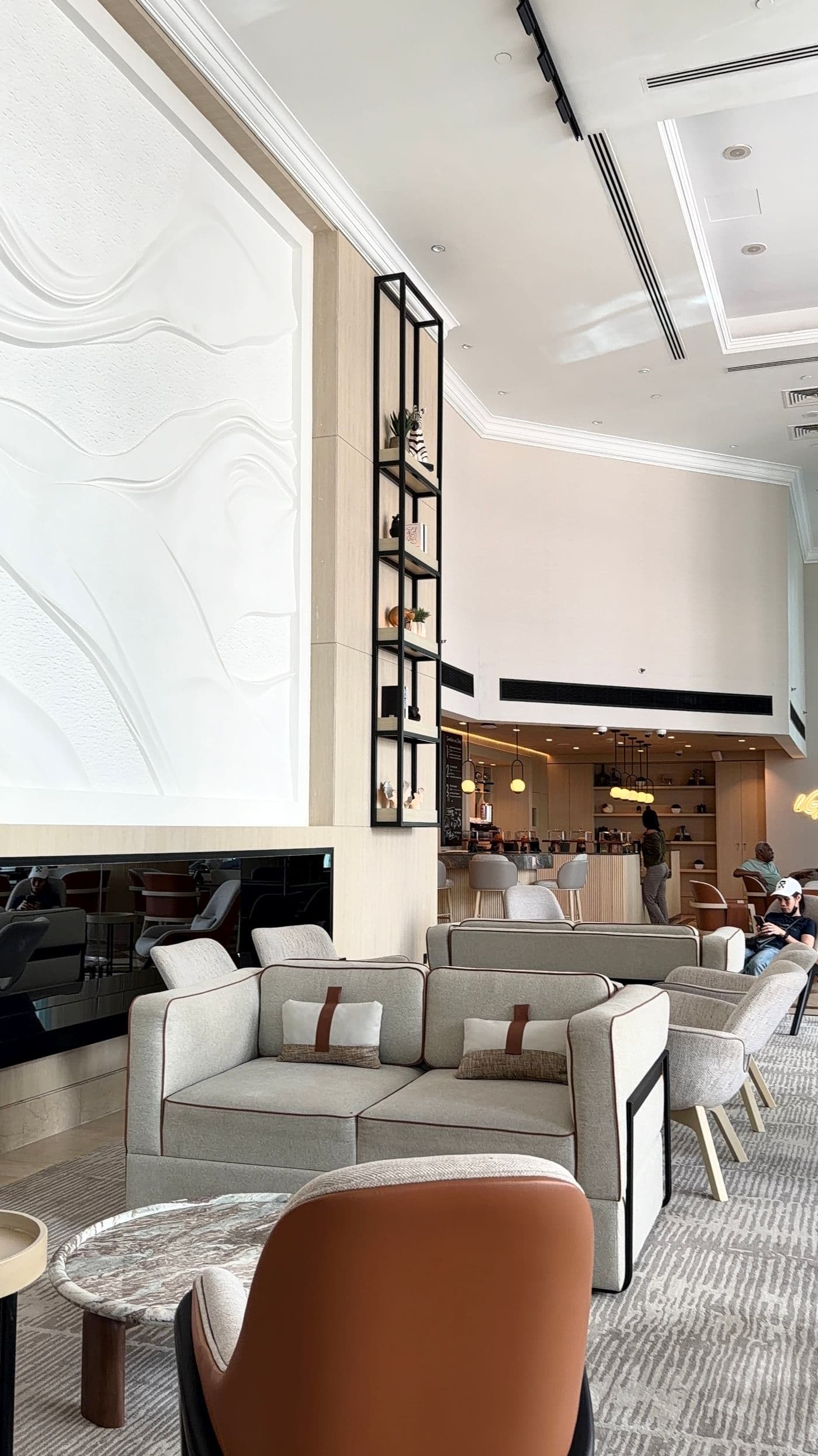 Contemporary hotel lounge with warm, neutral furnishings